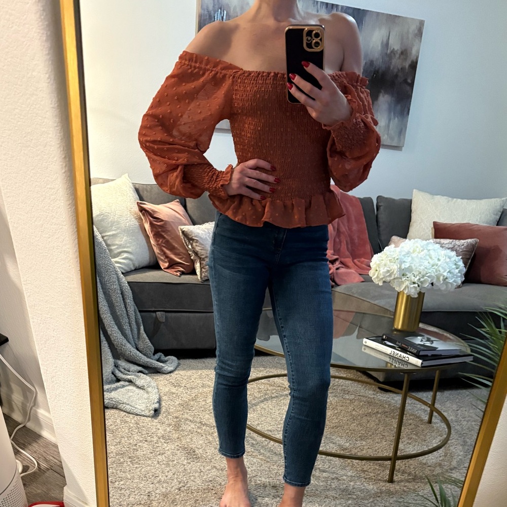 Burnt orange off the shoulder blouse purchased at a boutique